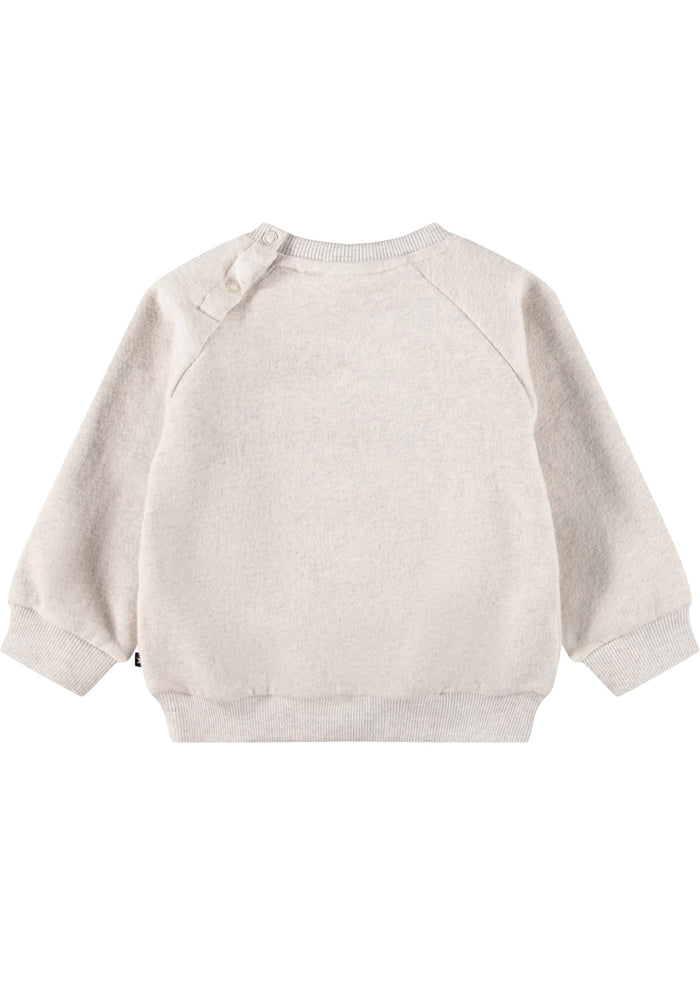 Beige baby sweater on a white background