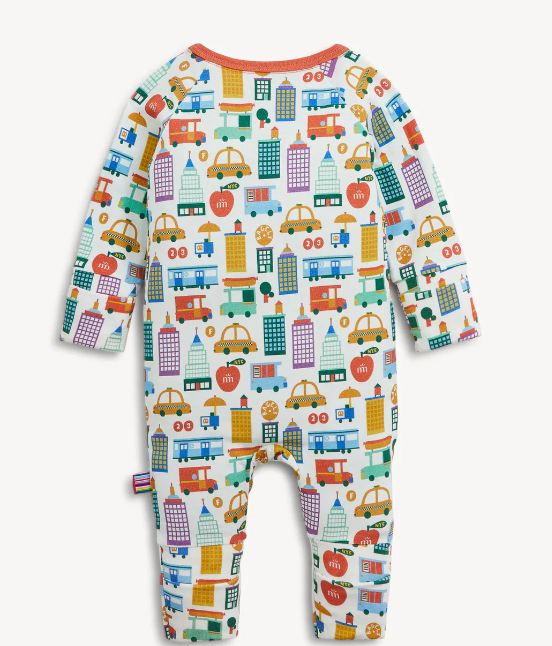 A baby long-sleeve footless one-piece romper with an all-over colorful city bus and taxi pattern on a white background, featuring a coral orange crew neck.