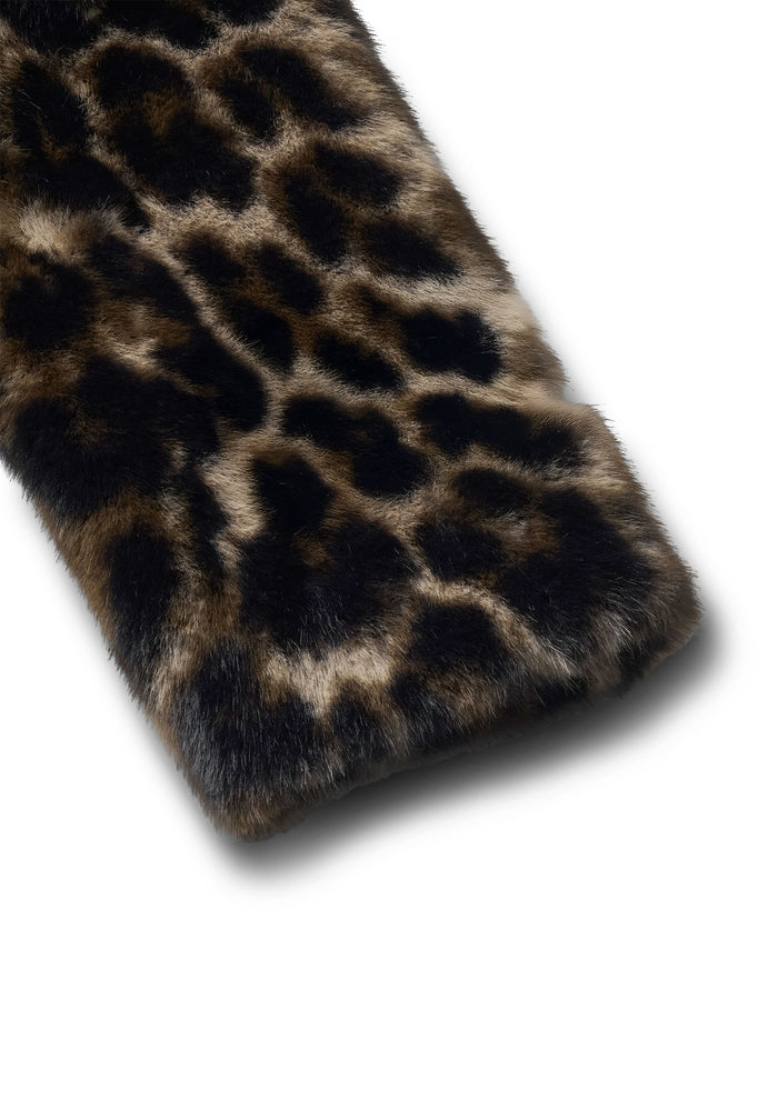 Leopard print fur product on a white background