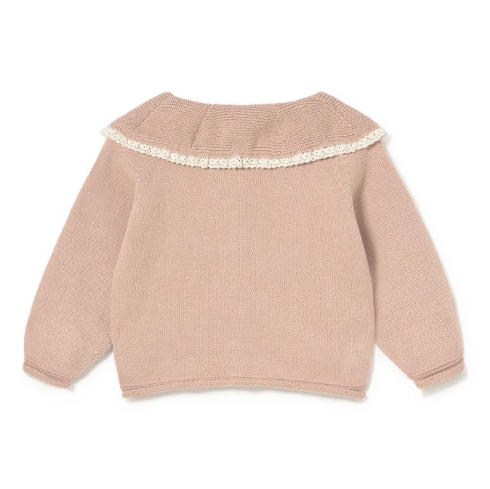 Pink sweater with lace trim on a white background