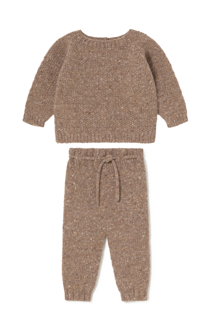 Brown knitted sweater and pants set on a white background