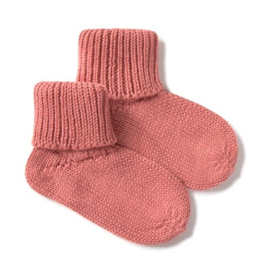 Pair of pink knitted baby socks on a white background
