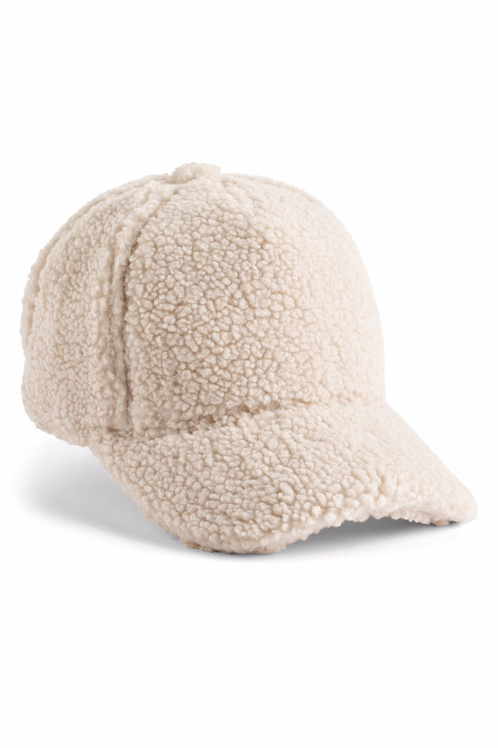 Beige sherpa-lined baseball cap on a white background