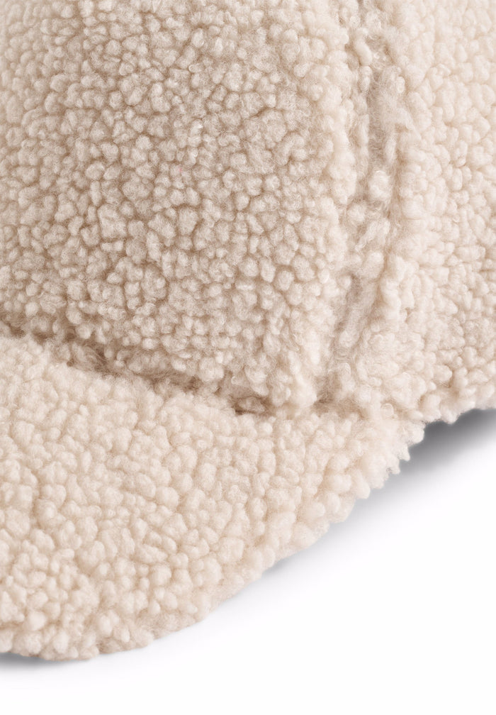 Close-up of a textured beige fabric surface